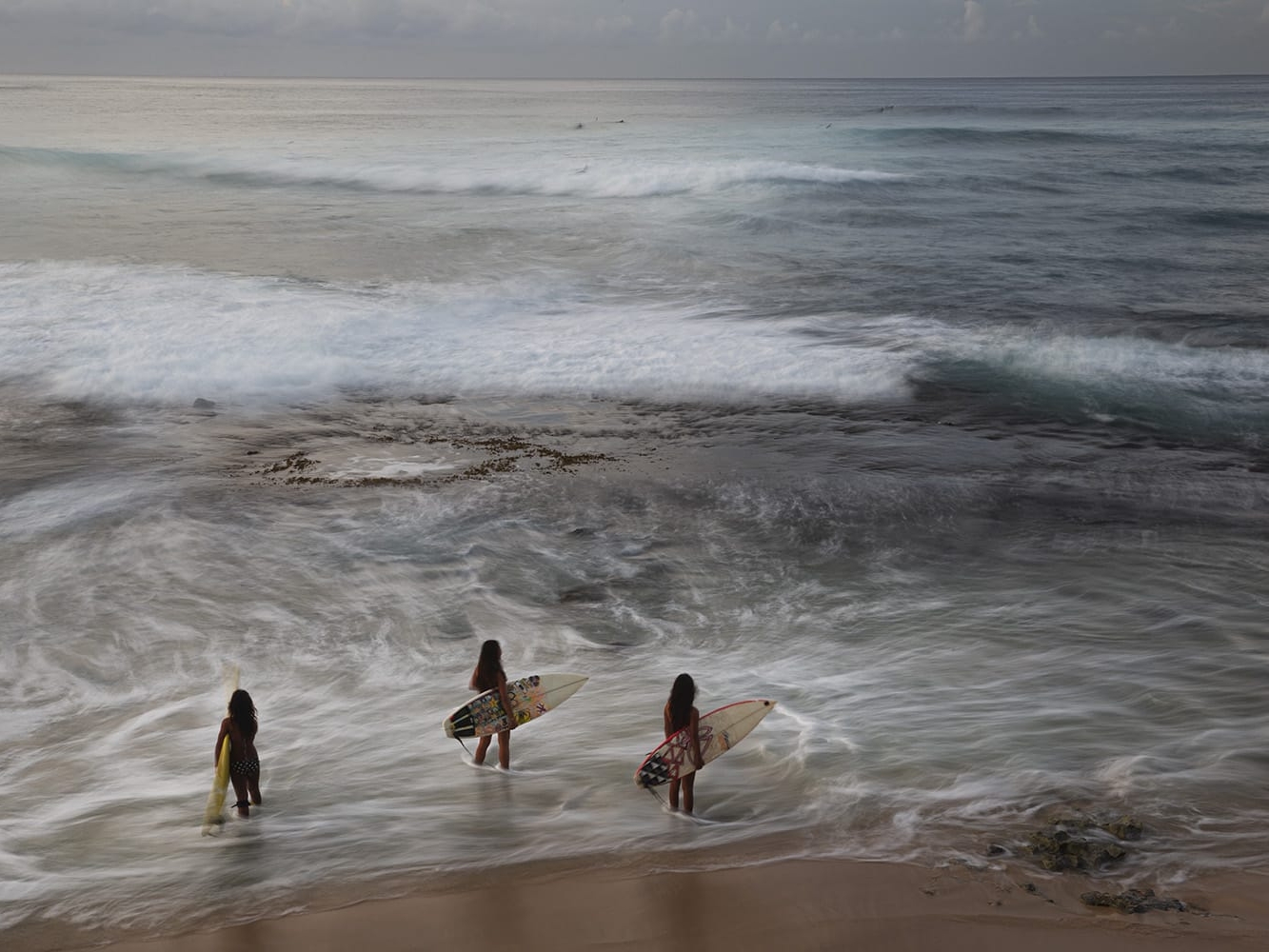 People at Makaha Beach. And tapping tattoo artist, Keone Nunes. Guy getting tattooed is knr.hamasaki@gmail.com. Long hair guy with tattoo on face is Kawika Au, Kalili. Big guy in background is Kalomo.