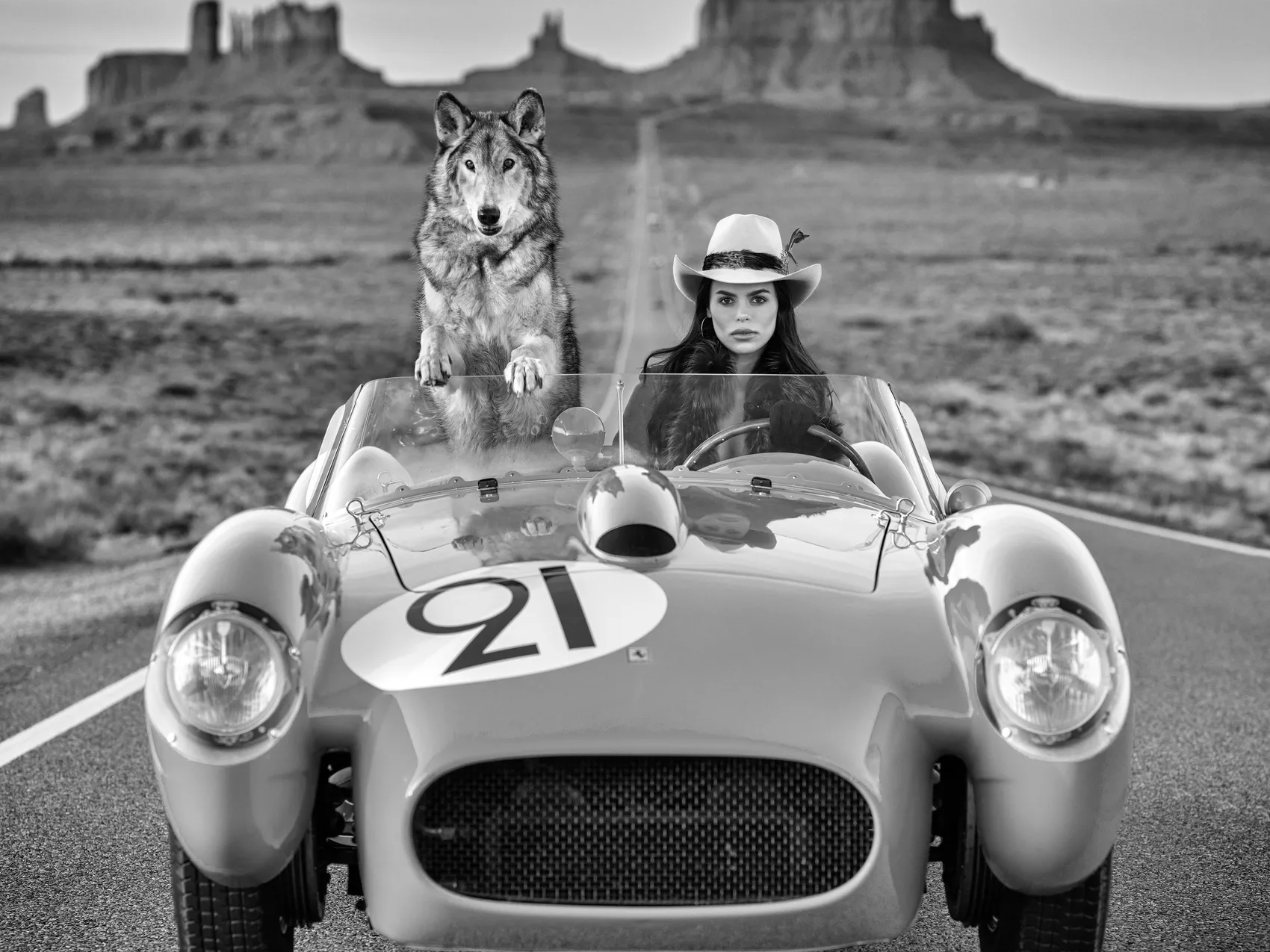 Testarossa (B&W) by David Yarrow Fine Art Photography | Brooks Nader Driving Yellow 1957 Ferrari Testarossa With a Wolf – Available at Hilton Contemporary Gallery Chicago