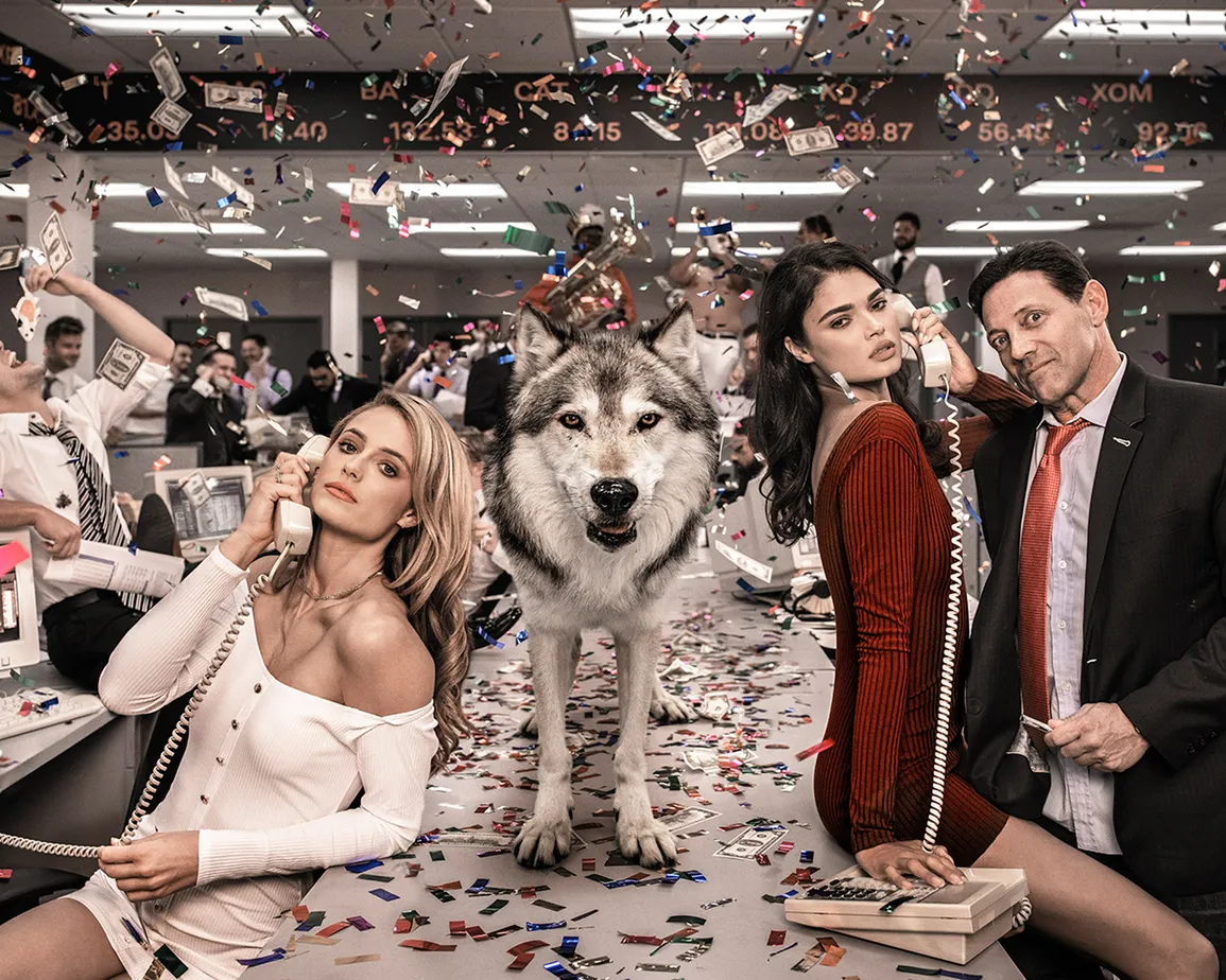 The Wolves of Wall Street II by David Yarrow – Jordan Belfort and Supermodels With Wolf on a Table and Money Flying in the Air – In Color - Available at Hilton Contemporary Gallery Chicago