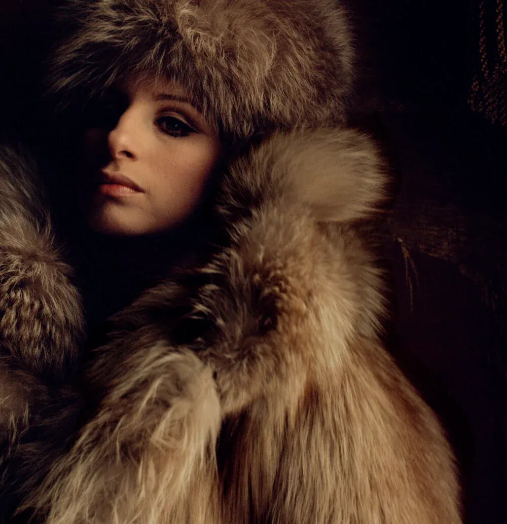 Barbra Streisand draped in fur in New York, photographed by Lawrence Schiller for McCall’s magazine, 1969