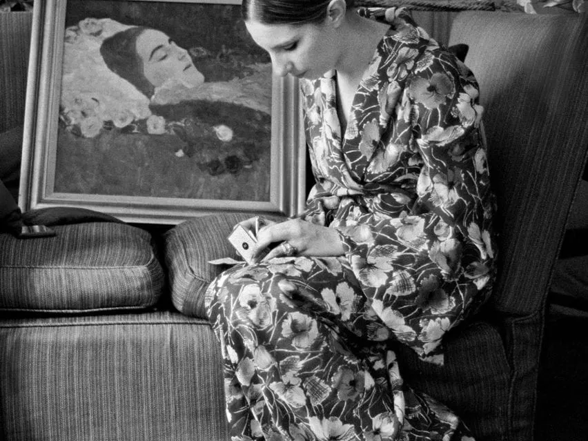Barbra Streisand writing a check to purchase a Gustav Klimt painting at Claridge’s Hotel in London, photographed by Lawrence Schiller, 1969