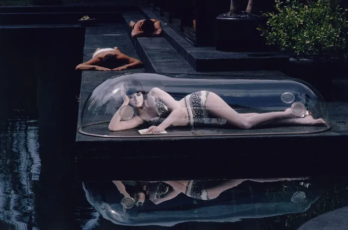 Girl in a Bubble photography showing a woman reclining inside a clear dome above water in Los Angeles, 1964