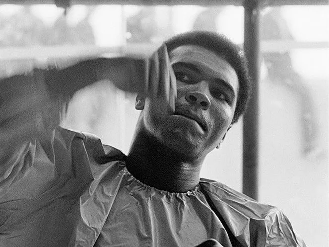 Muhammad Ali using the speedbag while training in Dublin, photographed by Terry O’Neill, 1972