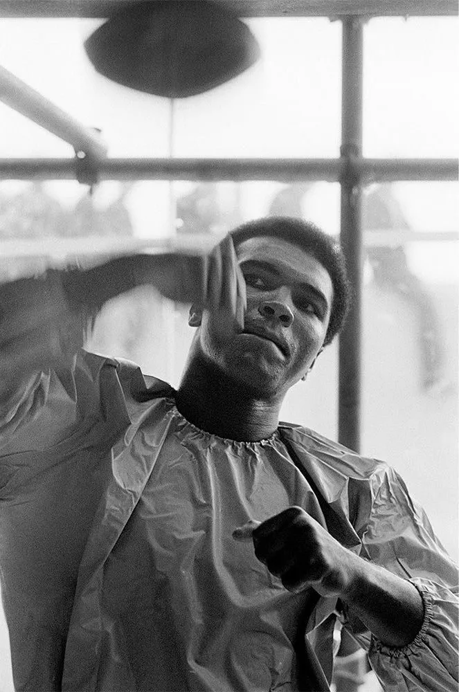 Muhammad Ali using the speedbag while training in Dublin, photographed by Terry O’Neill, 1972