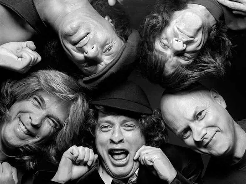 AC/DC photographed through glass in London, 1990, black and white limited edition photograph by Terry O’Neill | Available through Hilton Contemporary Gallery