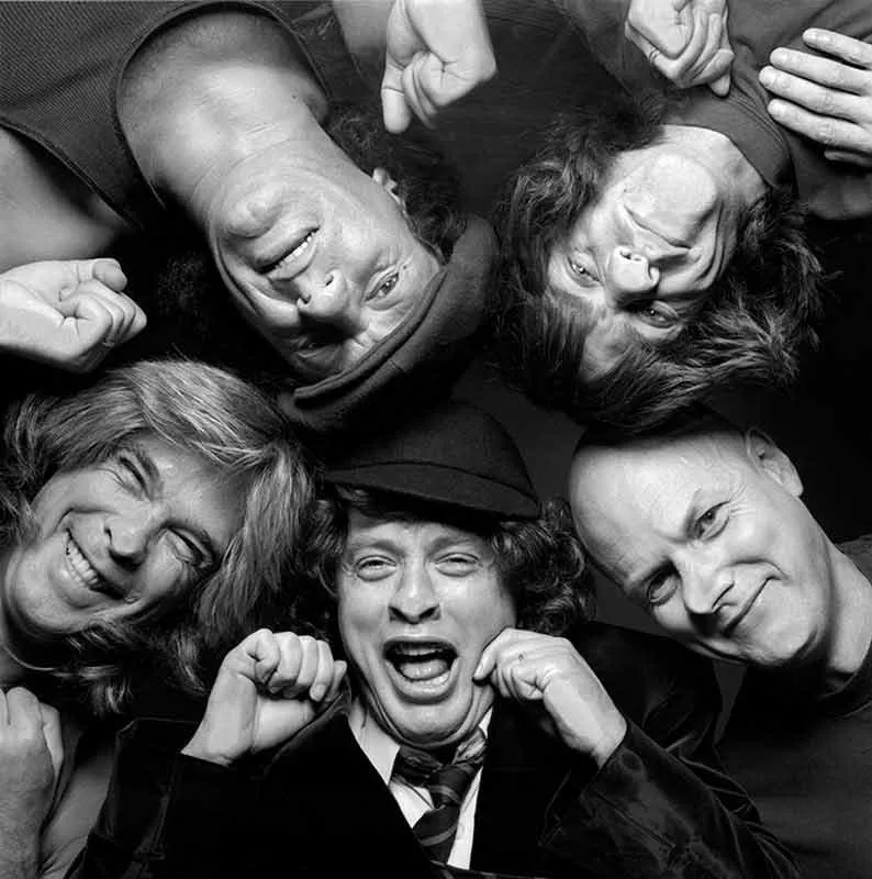 AC/DC photographed through glass in London, 1990, black and white limited edition photograph by Terry O’Neill | Available through Hilton Contemporary Gallery