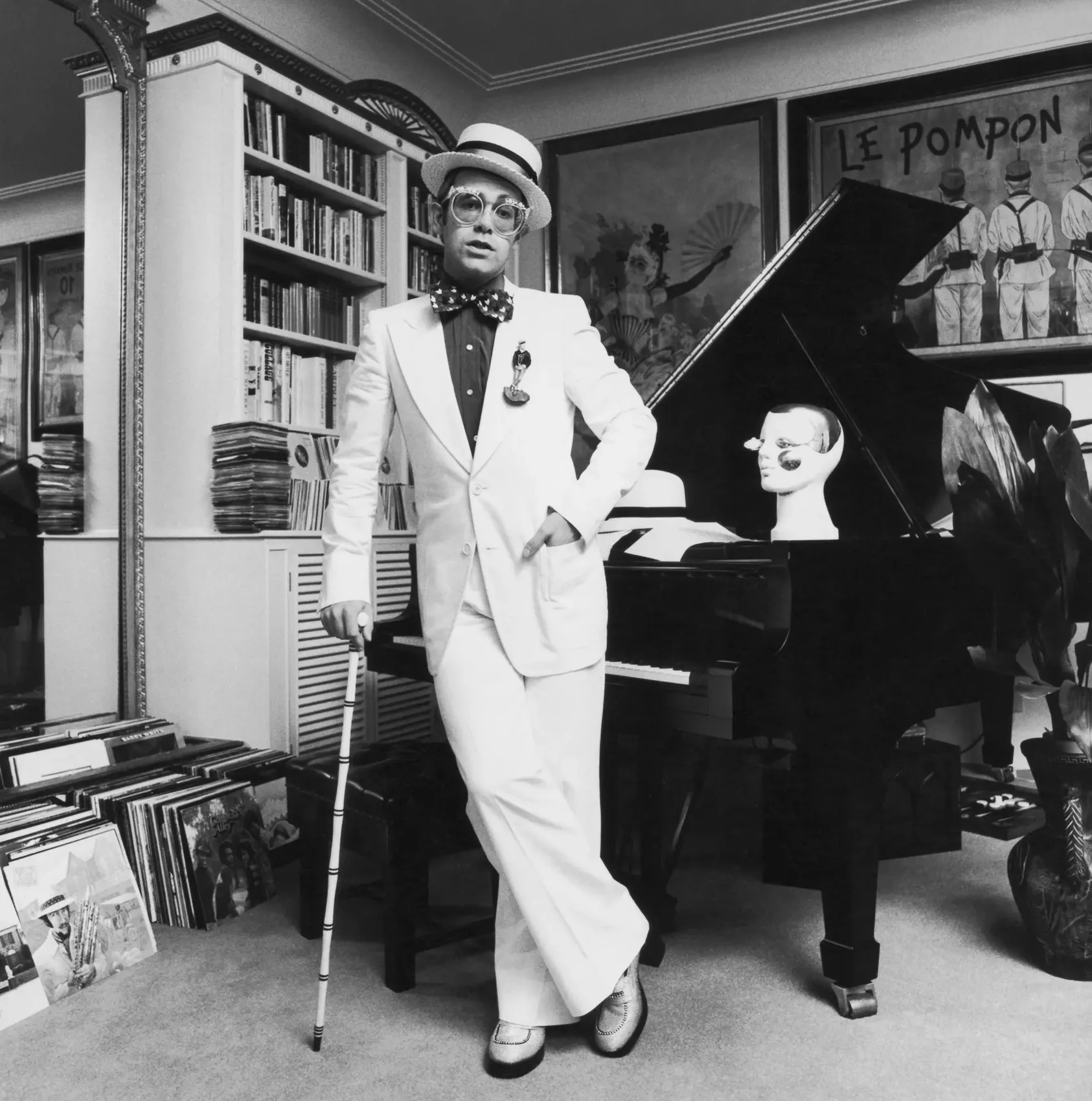 Elton John standing beside his piano at his home in Windsor during a 1974 album shoot