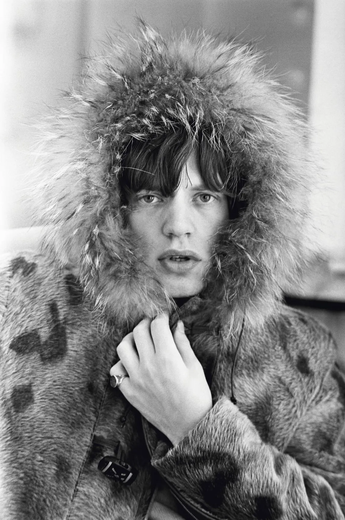 Mick Jagger wearing a fur parka, photographed in 1964 by Terry O’Neill