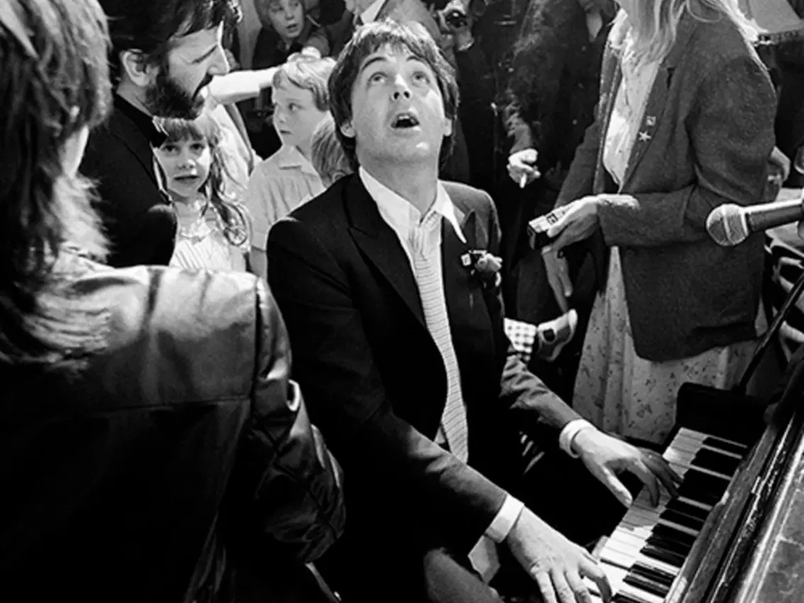 Paul McCartney playing piano at Ringo Starr’s wedding in London, 1981