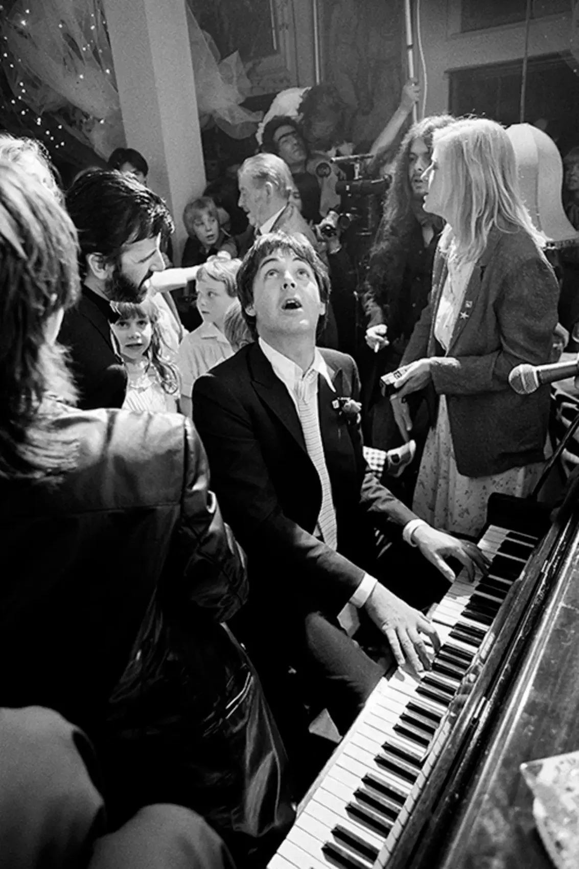Paul McCartney playing piano at Ringo Starr’s wedding in London, 1981