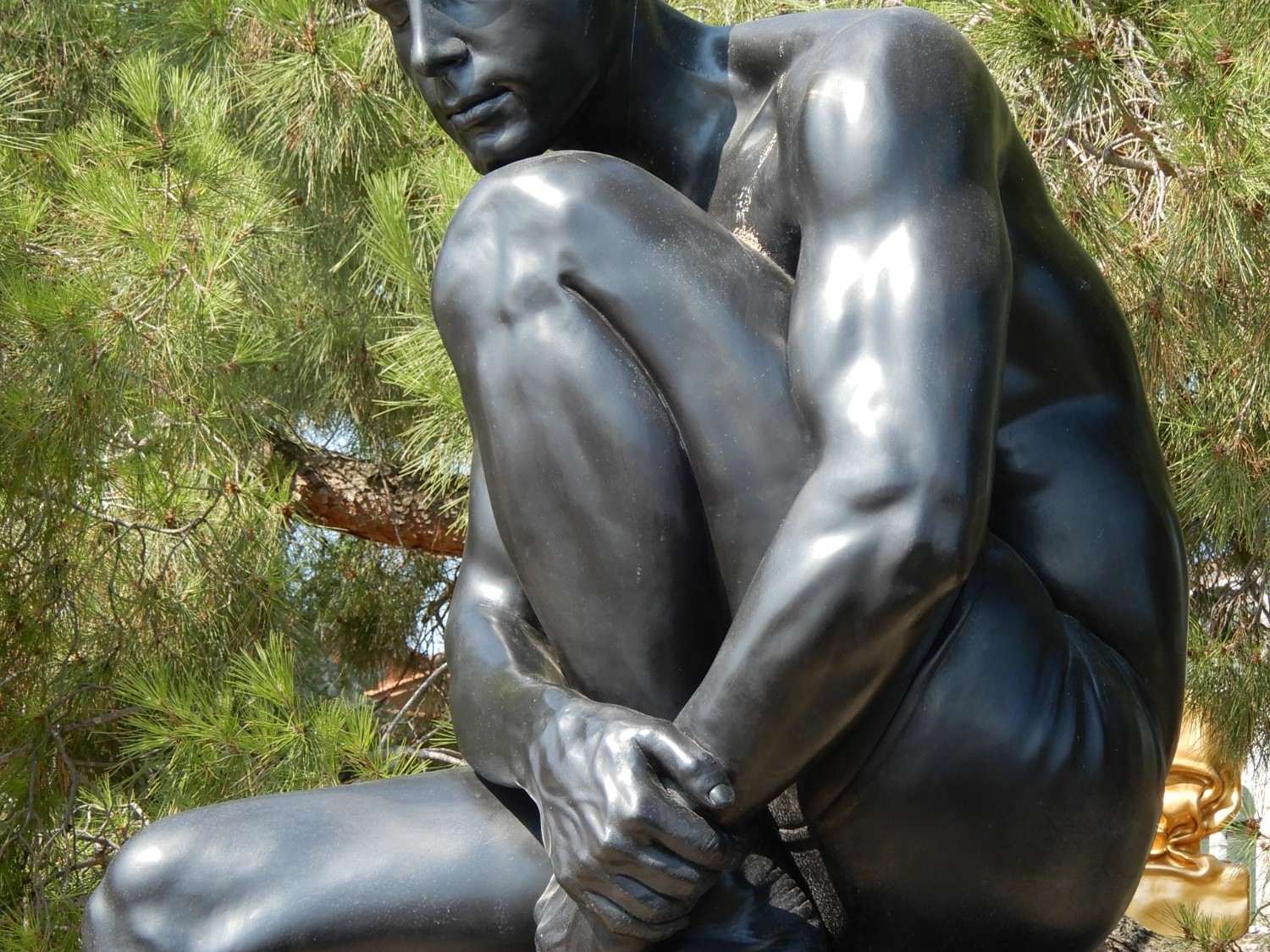 The Thinker. A hyper-realistic sculpture by Carole Feuerman. Painted Bronze with 24k Gold Leaf Cap on Steel Base. Museum Scale. 71 x 32 x 32 inches.