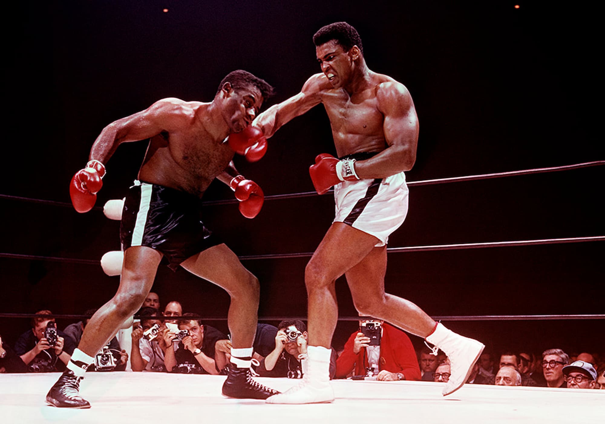 Ali landing a punch on Patterson during their heavyweight title fight in Las Vegas — Muhammad Ali vs. Floyd Patterson, 1965, Lawrence Schiller.