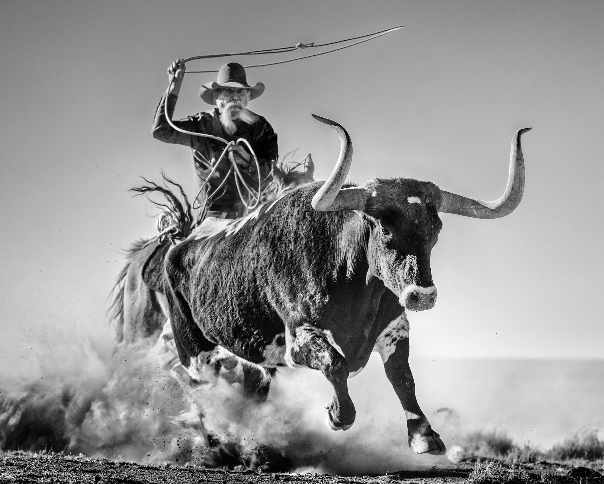 "Ain't My First Rodeo" by David Yarrow, West Texas, Texas, 2021. Black and white photograph.