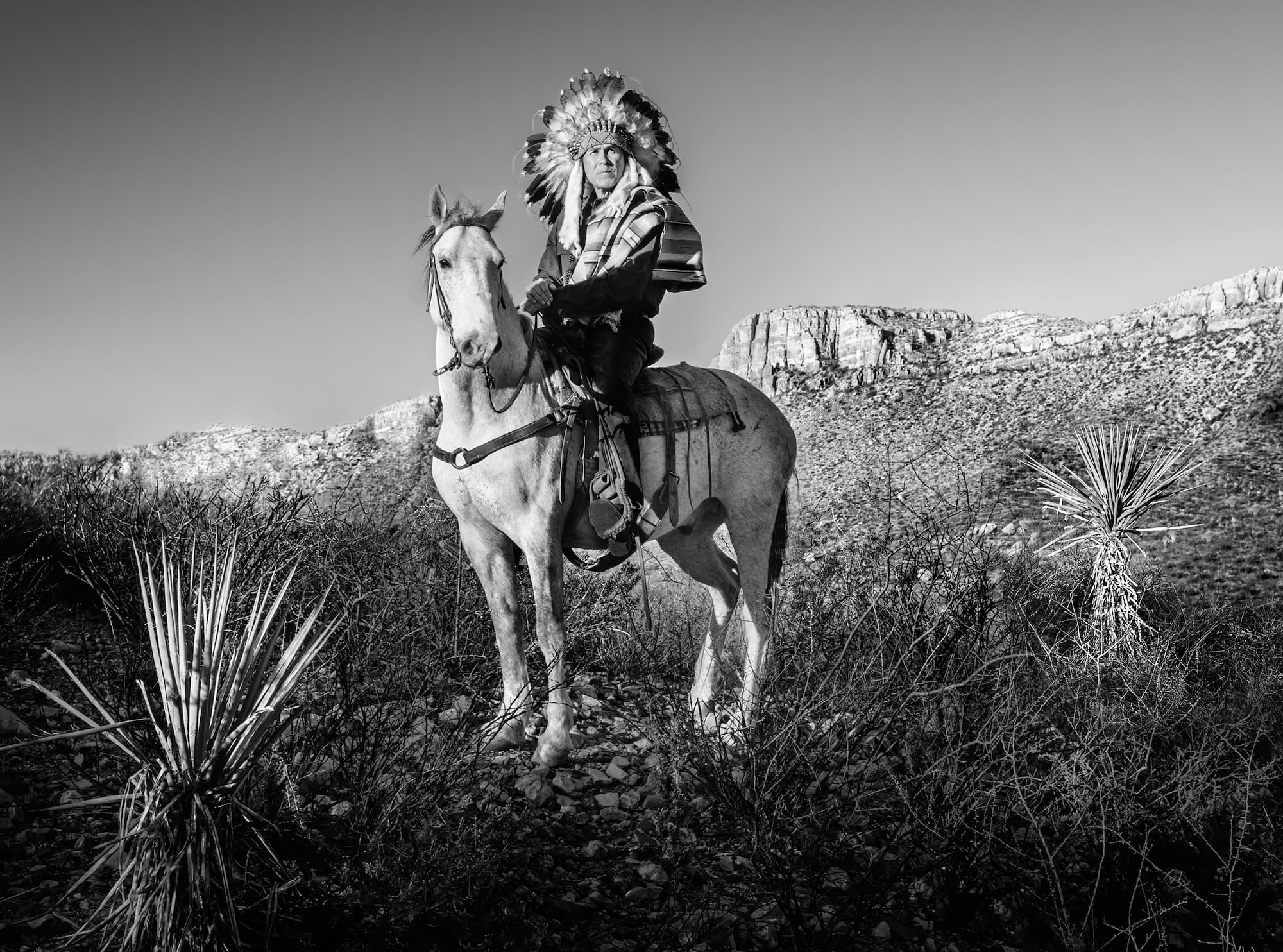 "Apache" by David Yarrow, West Texas, Texas, 2021. Black and white photograph.
