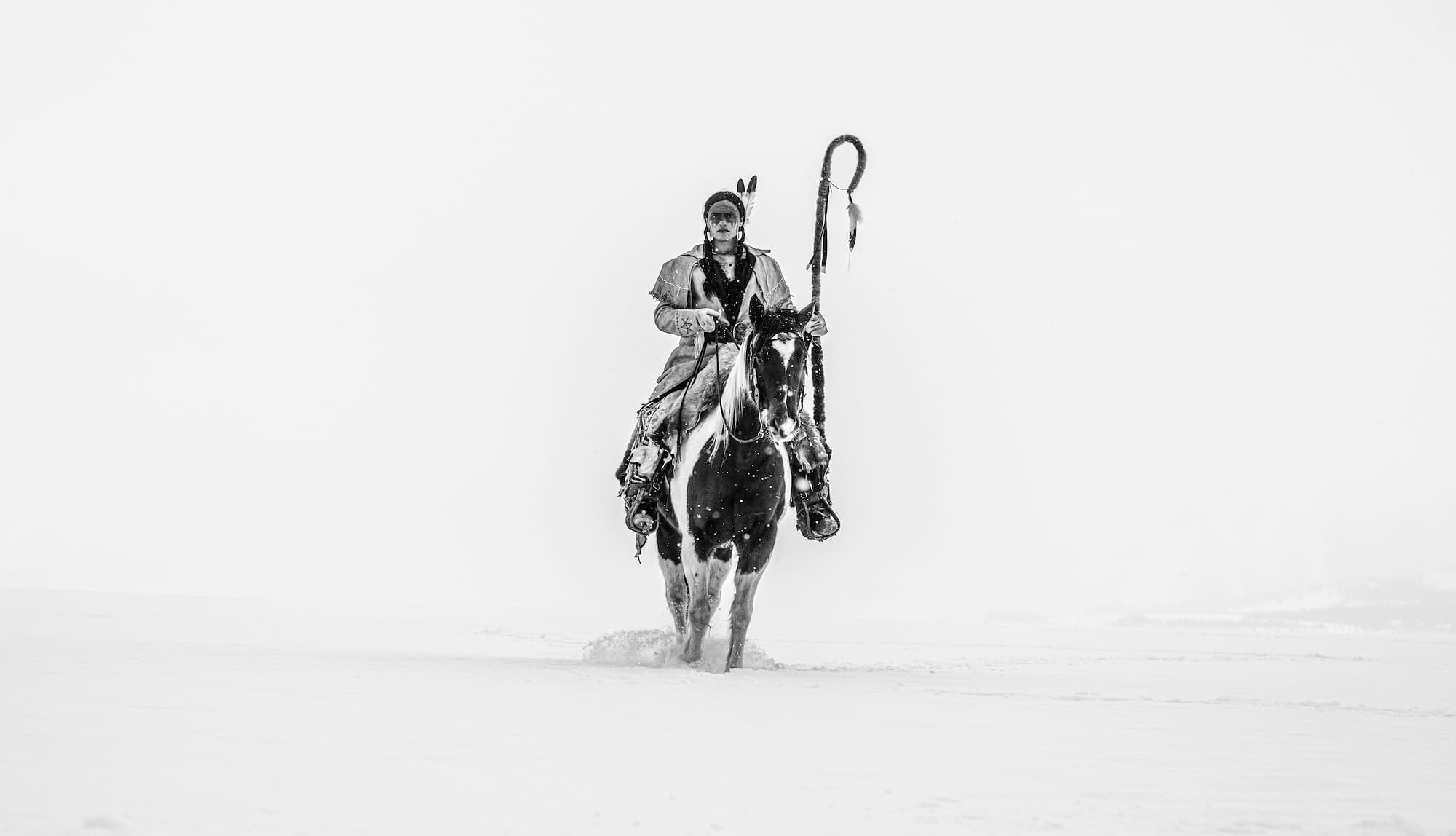 "Ghost Rider" by David Yarrow, Grand Tetons, Wyoming, 2021. Black and white photograph.