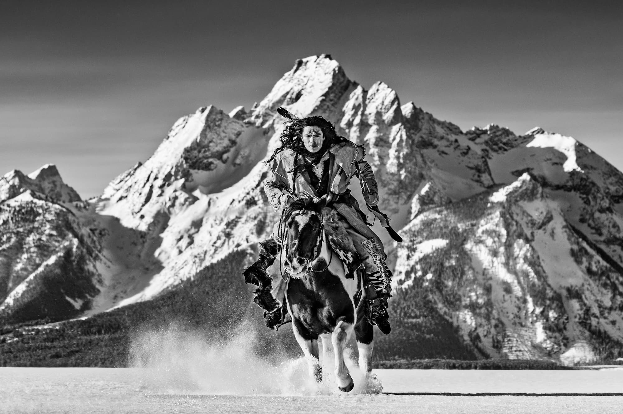 "High Noon" by David Yarrow, Grand Tetons, Wyoming, 2021. Black and white photograph.
