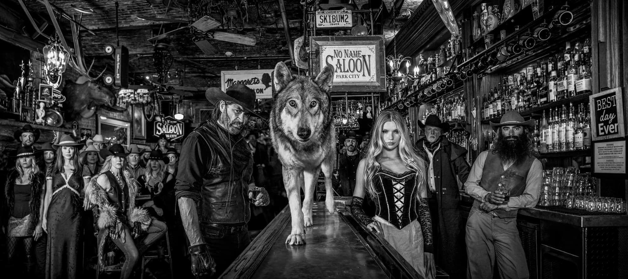 "Moths to a Flame" by David Yarrow, Park City, Utah, 2026. Black and white photograph.