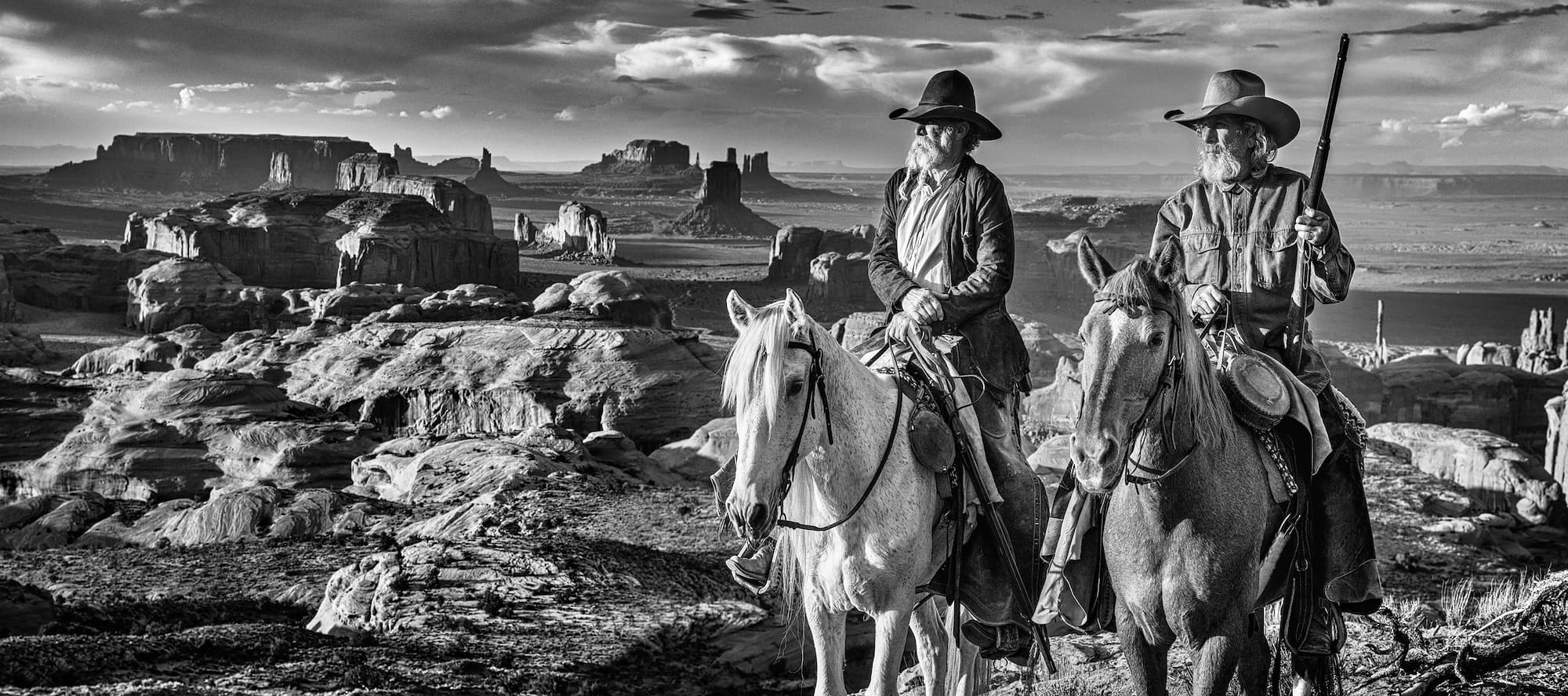 "Raising Arizona" by David Yarrow, Monument Valley, Arizona, 2022. Black and white photograph.