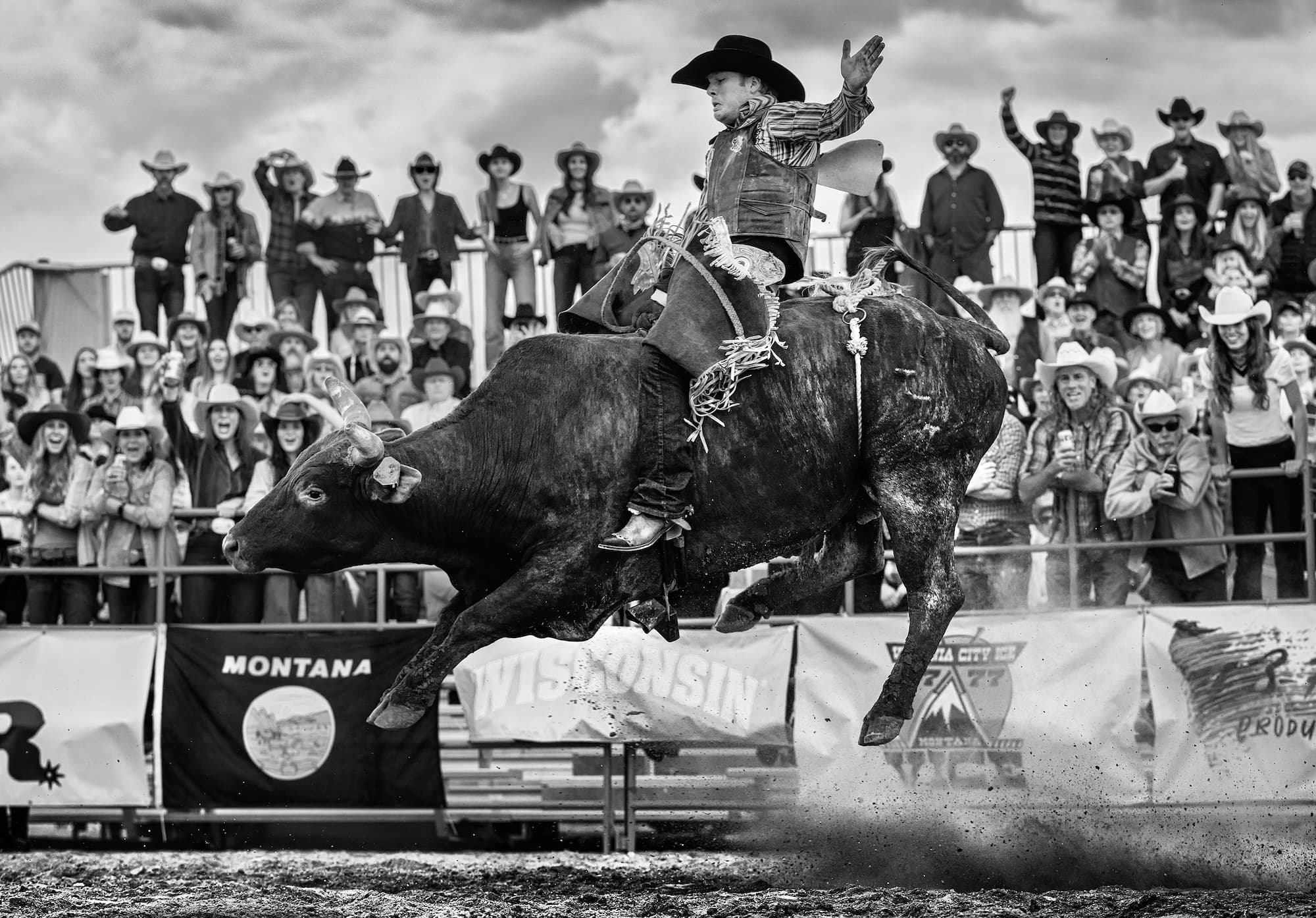 "Ride the Bull" by David Yarrow, Bozeman, Montana, 2023. Black and white photograph.