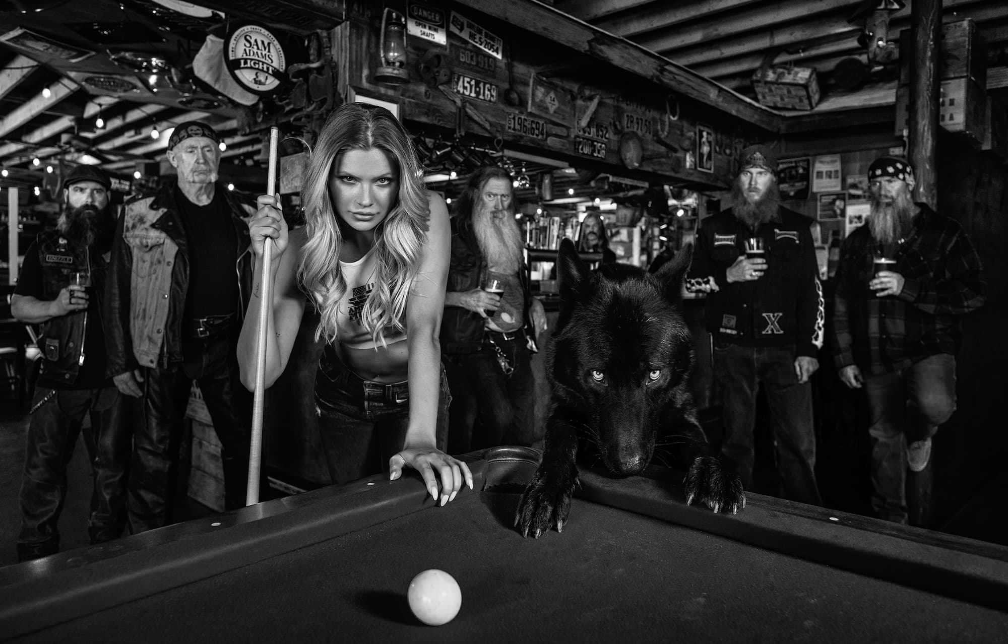 "The Girl and the Wolf" by David Yarrow, Palm Desert, California, 2023. Black and white photograph.