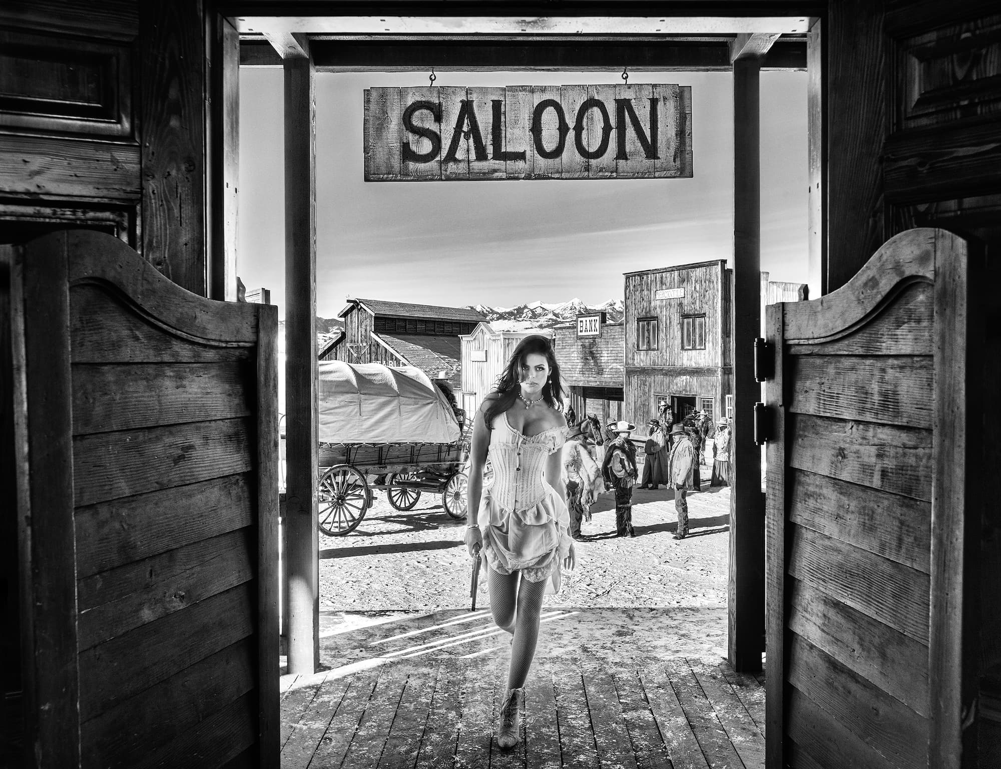 "The Girl With The Golden Gun" by David Yarrow, Paradise Valley, Montana, 2023. Black and white photograph.
