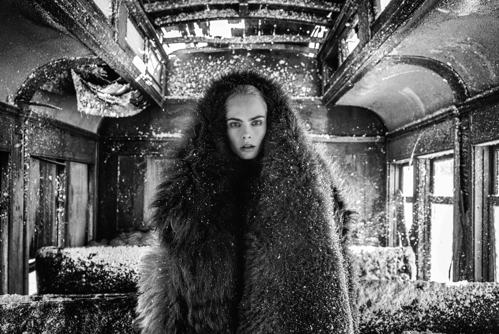 "The Girl with the Lion Tattoo" by David Yarrow, Nevada City, Montana, 2020. Black and white photograph.