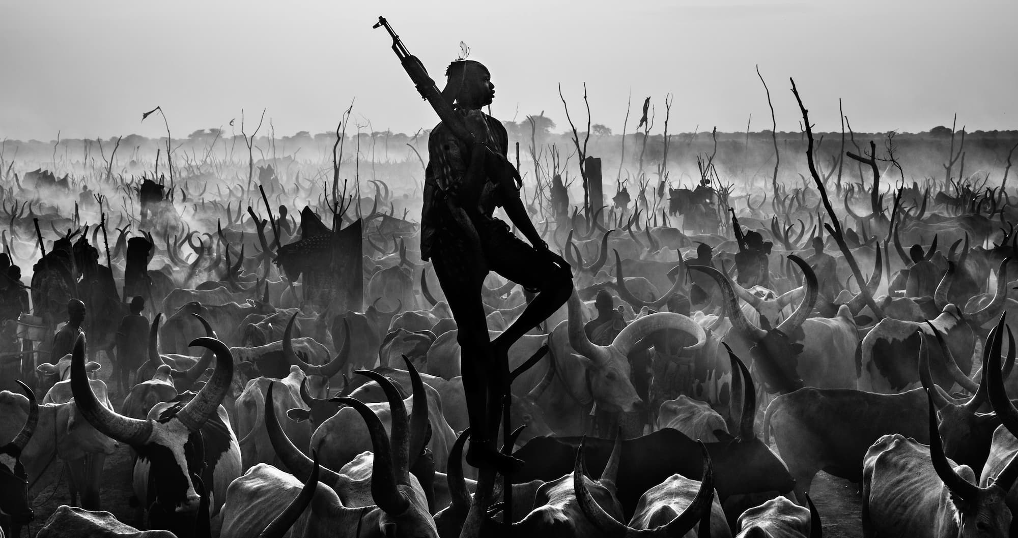 "The Proud Nightwatchman" by David Yarrow, South Sudan, 2015. Black and white photograph.