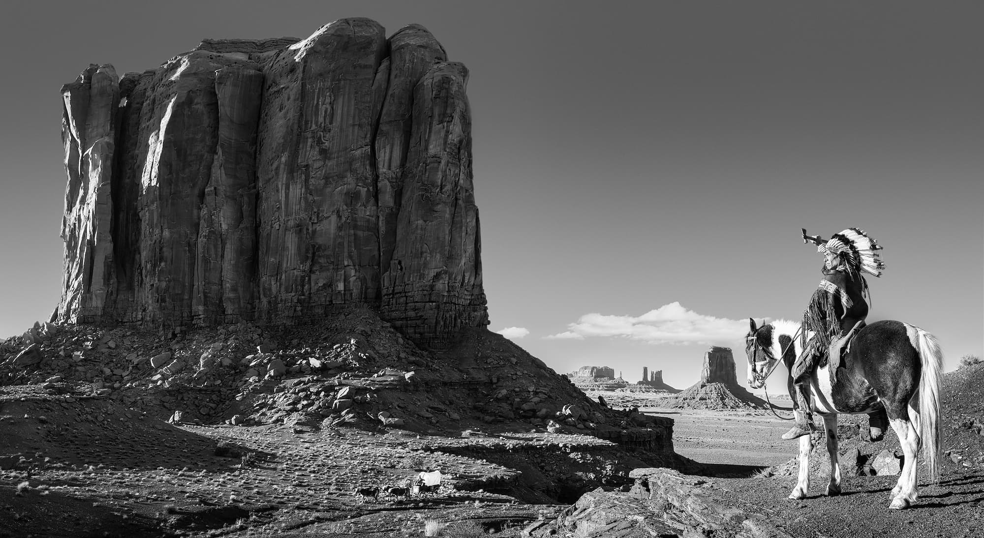 "The Push West" by David Yarrow, Monument Valley, Utah, 2022. Black and white photograph.